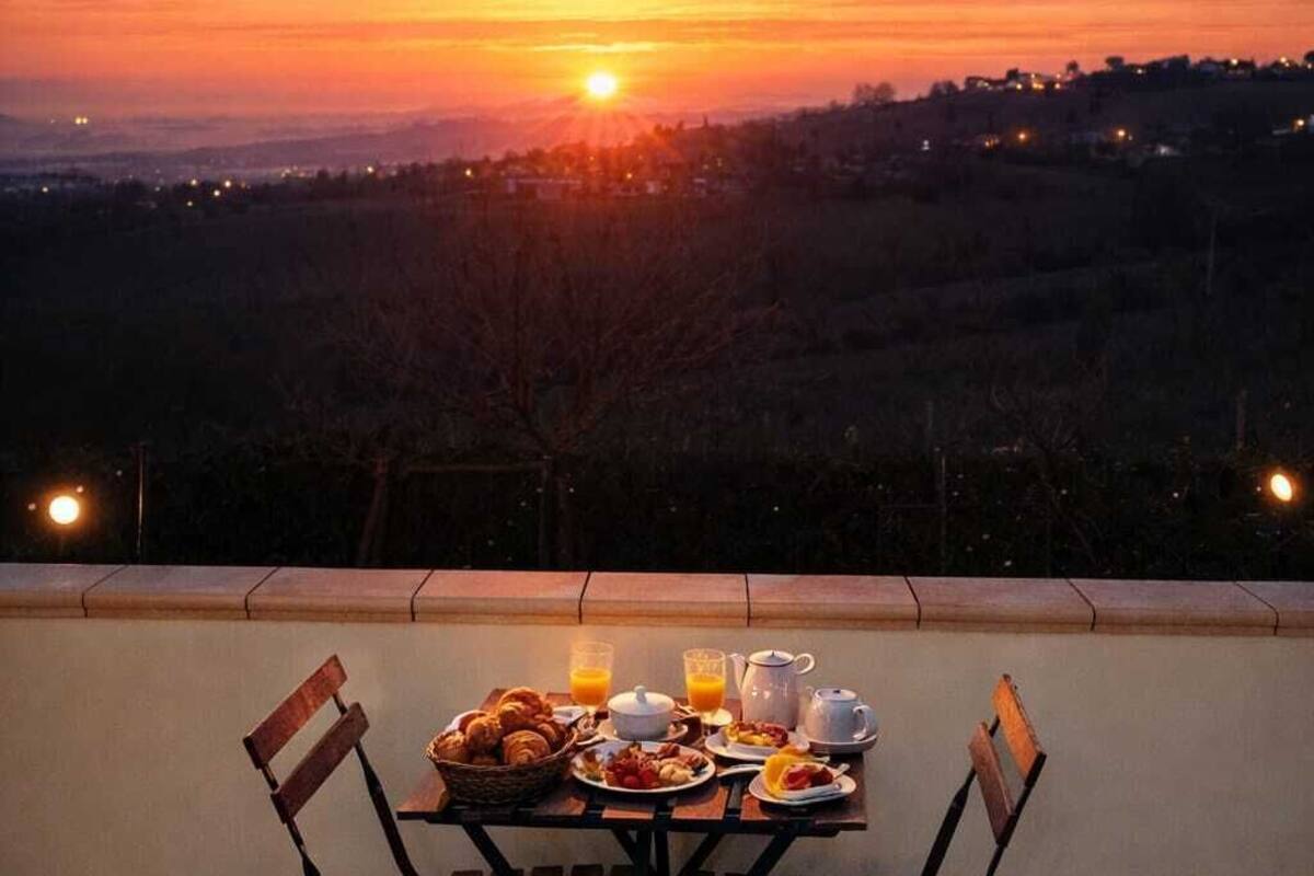 A table set for breakfast with a scenic sunset view.