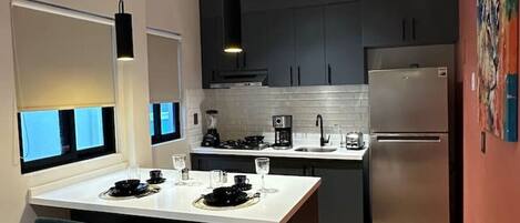 Microwave, stovetop, toaster, cookware/dishes/utensils