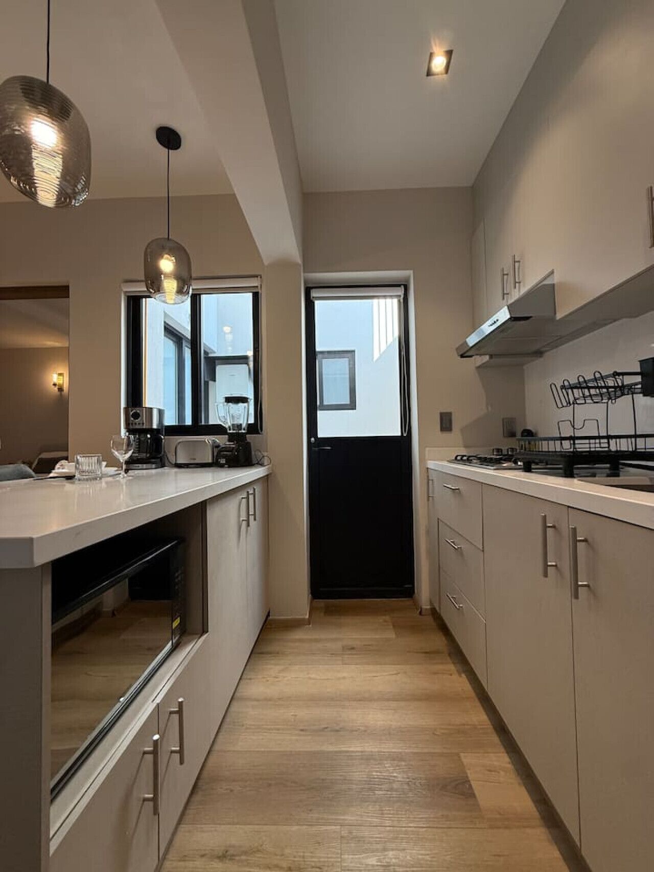 Fridge, microwave, stovetop, coffee/tea maker