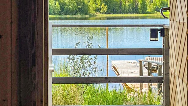 A wooden cabin with a view of a lake and forest. - Vacation home Metsis by Interhome (Nurmes)