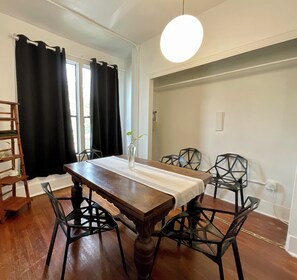 Deluxe Apartment, 2 Bedrooms, Kitchen, Courtyard Area | In-room dining