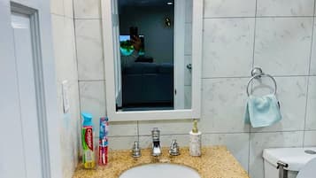 Bidet, towels, soap, toilet paper