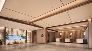 A spacious lobby with a reception desk, a large digital screen displaying a tropical scene, and a modern ceiling design. - Hilton Garden Inn Chengdu Huaxi Wuhou Shrine (Nanchong)
