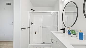 Shower, hair dryer, towels, soap