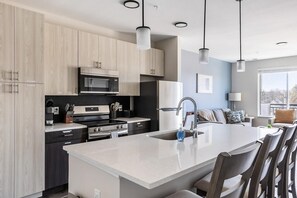 Fridge, dining tables - Landing | Stunning 1BD, Pool, Gym (Indianapolis)