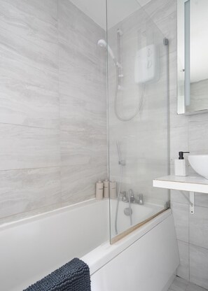 Shower, eco-friendly toiletries, hair dryer, towels