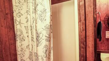 Shower, towels, soap, toilet paper