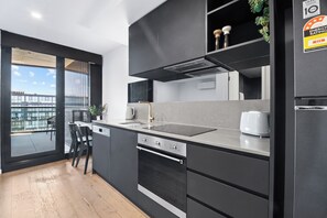 Microwave, oven, stovetop, dishwasher - Elegant Top Floor 1BR, Sleeps 4, City Views (Reid)