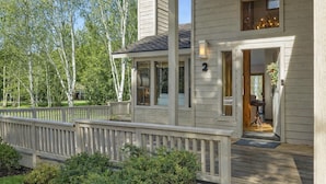 A two-story house with a deck, a front porch, and a visible entryway. - The Aspen Hideaway | Elkhorn Pool, Hot Tub + Pickleball (Sun Valley)