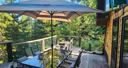 Pet friendly off grid chalet tucked away on a mountainside .