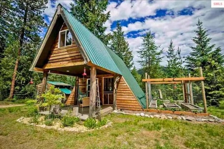 Exterior. Pet friendly off grid chalet tucked away on a mountainside .