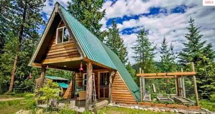 Pet friendly off grid chalet tucked away on a mountainside .