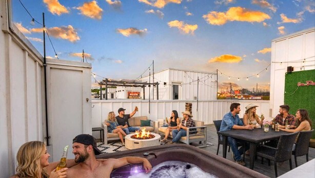 A rooftop bar with outdoor seating, a fire pit, and a hot tub. - Jungle Fun House, Karaoke, Minutes to Broadway (Nashville)