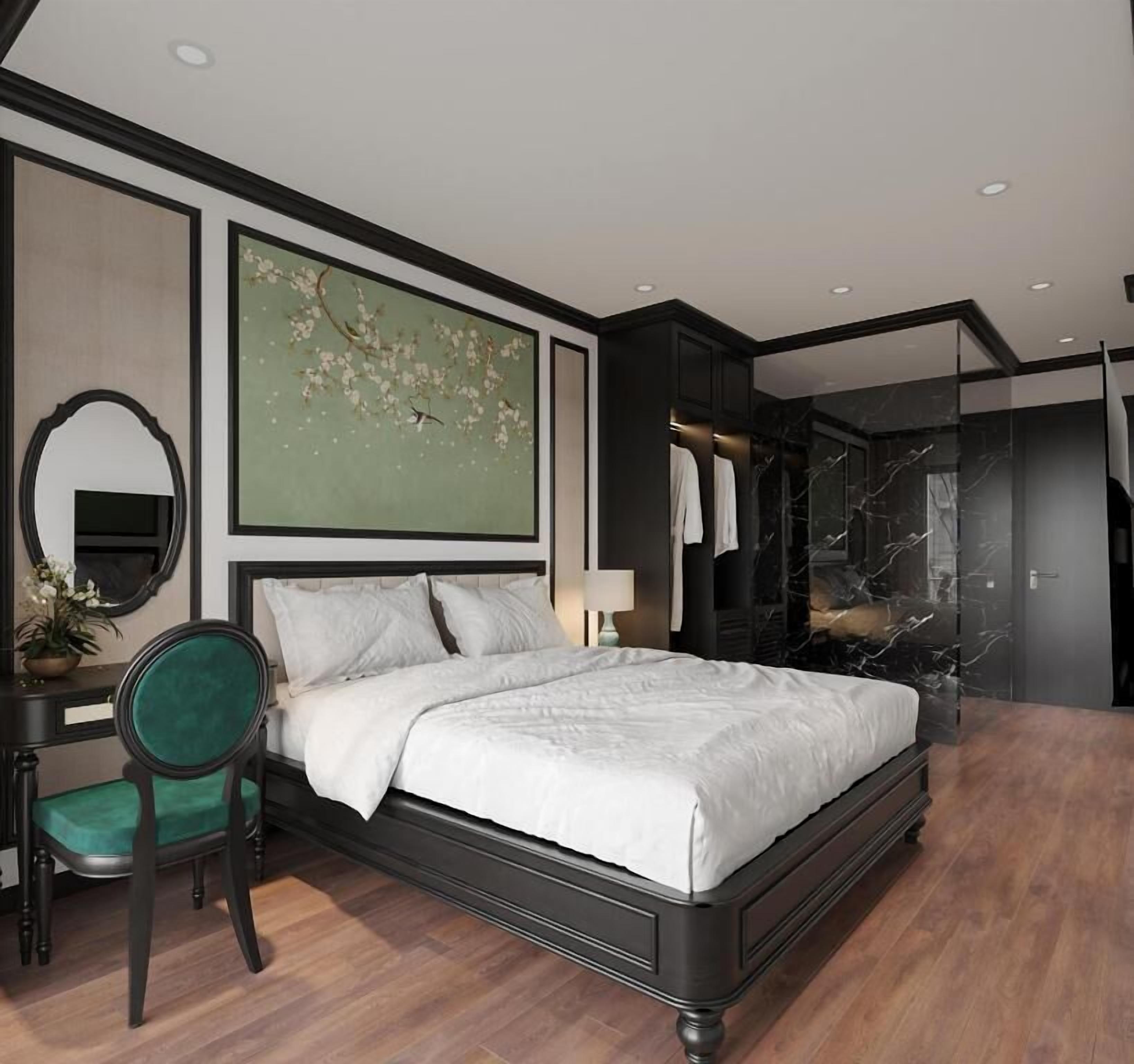 A modern bedroom with a large bed, a desk, a chair, a mirror, and a bathroom with a marble wall.