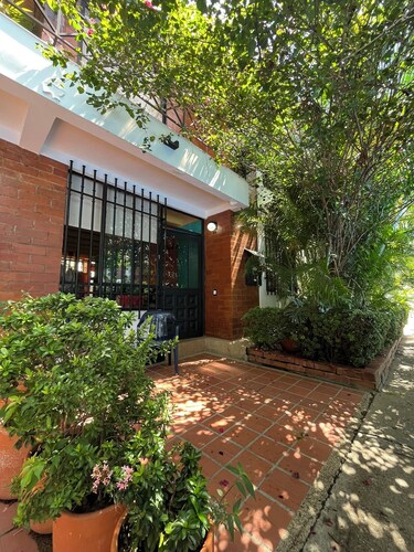 A colorful, peaceful oasis in Girardot, a bright family home designed for rest.