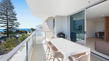 Apartment, Balcony, Beach View | Outdoor dining