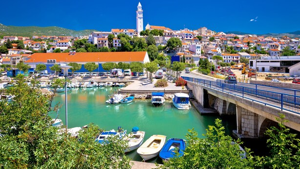 A coastal town with a prominent tower, a marina with boats, and a bridge connecting different areas. - Pool Apt 3 - Novi Vinodolski (Ground), Novi Vinodolski, Croatia (Novi Vinodolski)