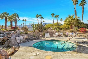 A pool area with lounge chairs, palm trees, and a view of mountains. - Pueblo Vista (Palm Springs)