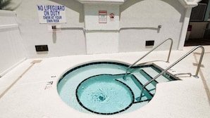 A swimming pool with a sign stating "NO LIFEGUARD ON DUTY SWIM AT YOUR OWN RISK." - Myrtle Beach Villas 105 A (Myrtle Beach)