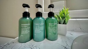 Three bottles of skincare products on a bathroom counter. - Kingbed,a+location,a+for Workers, Longstaydiscount (Sherman)
