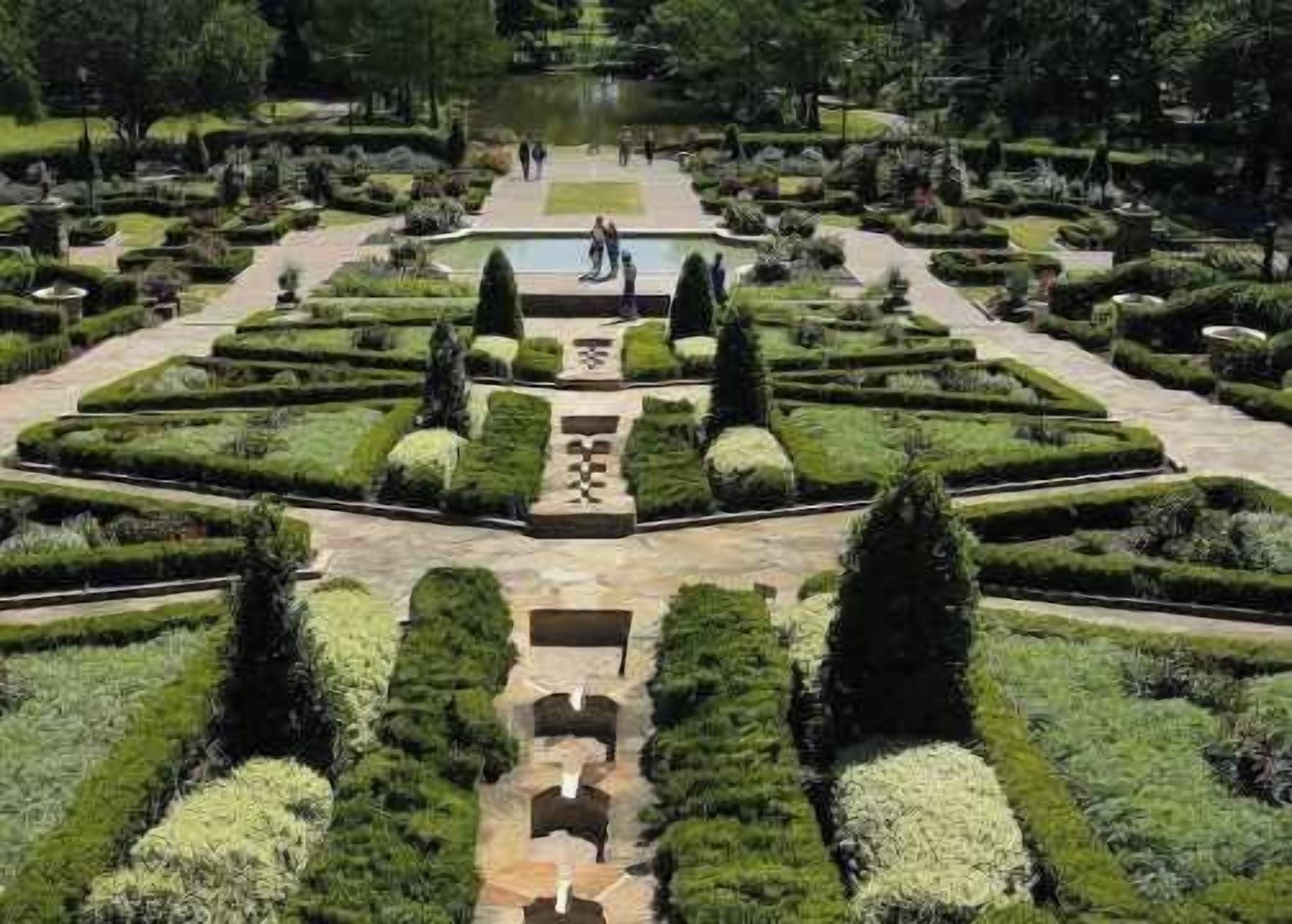 A formal garden with symmetrical pathways, neatly trimmed hedges, and a central water feature.