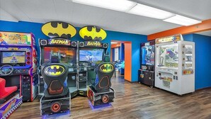 An arcade with Batman-themed machines and a white vending machine. - Caravelle 706 (Myrtle Beach)
