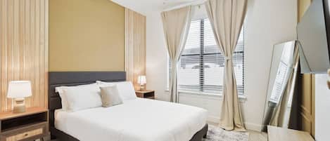 1 bedroom, laptop workspace, iron/ironing board, bed sheets