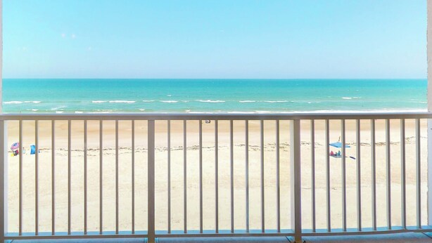 A balcony with a view of a beach. - Southpoint 303 (Ponce Inlet)
