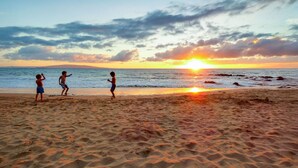 A beach scene with a sunset. - Kamaole Sands 5-414 (Kihei)