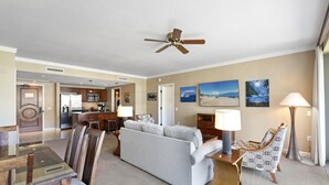 A hotel room with a living area, dining table, and kitchen. - Honua Kai Konea 505 (Kaanapali)