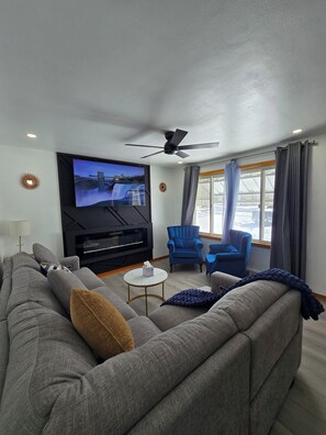 Smart TV, fireplace, table football, books