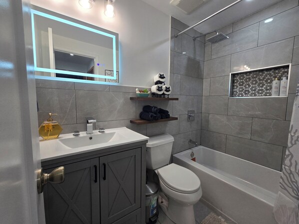 Hair dryer, towels, soap, shampoo