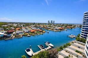 Aerial view - Cosy 3BR Apt in Harbourside with Parking - Canal view and Waterfront (Biggera Waters)