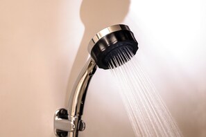 Combined shower/tub, hair dryer, slippers, towels