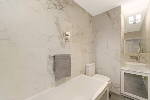 Jetted bath, hair dryer, bidet, towels