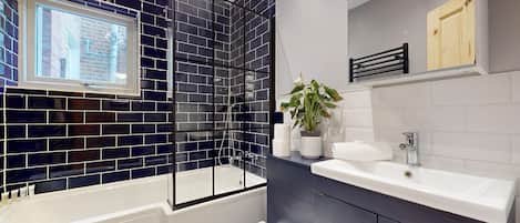 Hair dryer, towels, shampoo, toilet paper