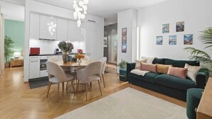 A modern apartment with a kitchen, dining area, and living room. - Central | AC | Private Terrace | Free Parking (Zürich)
