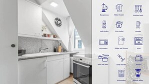 Une cuisine moderne avec des meubles blancs, un plan de travail en granit, un four encastré et un four à micro-ondes.