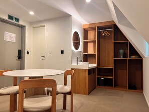 Deluxe Triple Room | Living area | 43-inch flat-screen TV with cable channels