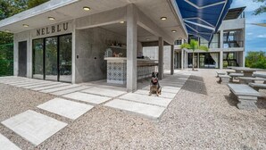 A modern building with a concrete facade and the name "NELBLU" on the entrance. - HOTEL NELBLU #4 - DOUBLE BEDS (Playa Flamingo)