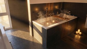 Um banheiro moderno com banheira, recurso de vapor e velas.