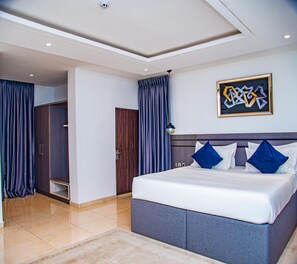 Family Room, Balcony, City View | Desk, laptop workspace, blackout drapes, soundproofing - Lugbe RestHouse (Lugbe)