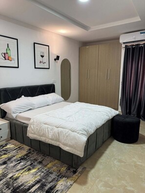 Economy Room, Balcony, City View | Desk, laptop workspace, blackout drapes, soundproofing