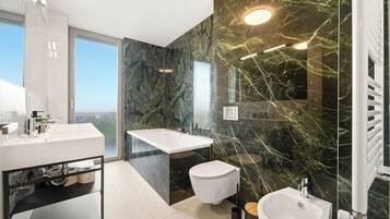 Family Apartment, 3 Bedrooms, Garden View | Bathroom | Hair dryer, slippers, towels, soap