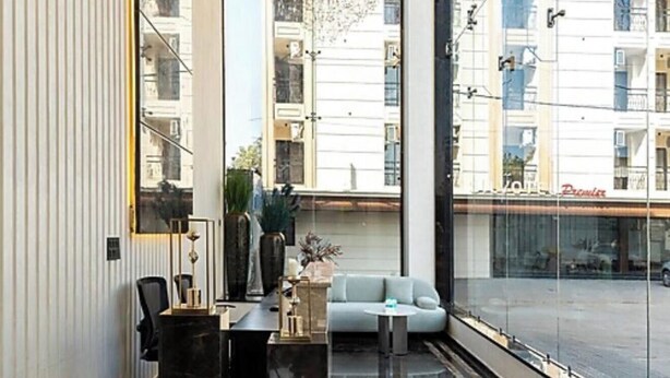 A modern interior with a sofa, a small table, and a chair.