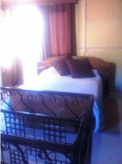 In the heart of Tana, view of the Queen's Palace, near Barea Stadium, in safety