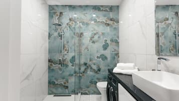 Shower, hair dryer, towels, shampoo