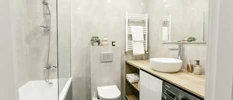 Shower, hair dryer, towels, shampoo