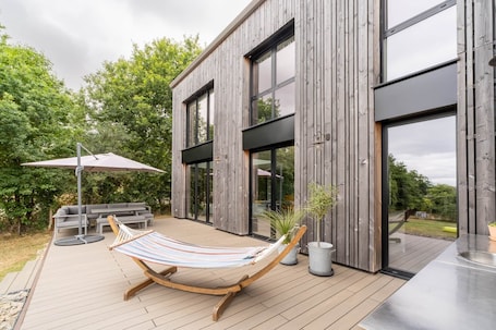 Terrace/patio. Architect-designed house in the heart of nature
