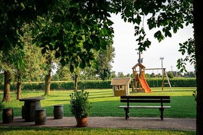 Classic Triple Room, Garden View | Children's area